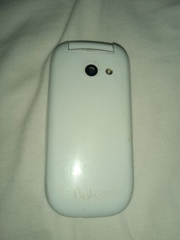 телефон fly era nano 2: Alcatel OT-E257, цвет - Белый, Кнопочный, Две SIM карты