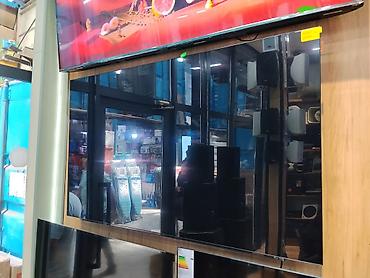 tv android: Ультратонкий LED-телевизор с большим экраном (приблизительно 65–75") — 1