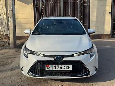 byd e2: Toyota Corolla: 2021 г., 1.8 л, Вариатор, Гибрид, Седан — 1