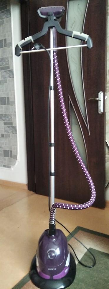 mac utu feni: Paltar buxarlı ütüsü – dik vəziyyətdə ütüləmə üçün Buxar ütüsü — 1