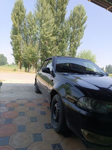 авто в рассрочку без банка без первоначального взноса в бишкеке: Черный седан Daewoo Nexia с тонированными стеклами и черными стальными