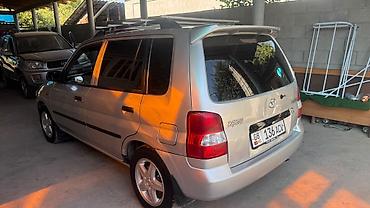 mini ev: Mazda Demio: 2000 г., 1.5 л, Механика, Бензин, Хэтчбэк — 1