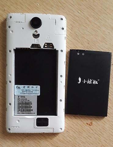 redmi a55: Смартфон Xiaolajiao (логотип с перчиком), бело‑серебристый корпус. б/у — 2