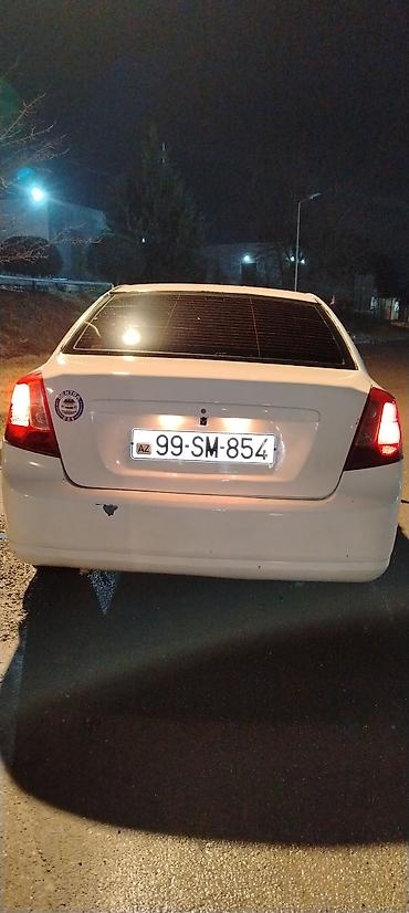 Daewoo: Sedan avtomobil – ağ rəng Model:tipli 4 qapılı sedan Kuzov: ağ rəng — 9