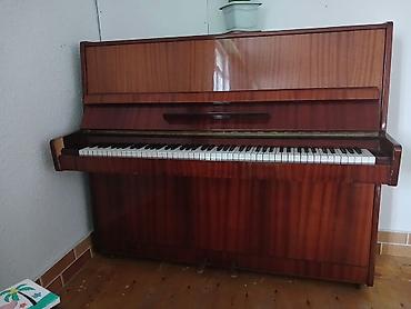 Musiqi alətləri: Dik piano – klassik üslubda akustik upright model. Xüsusiyyətlər: - — 1