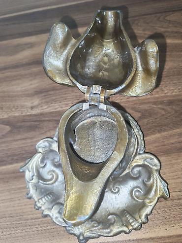 itmiş əşya: Məhsul: Metal it başlı masaüstü küyəhlik/siqaret külqabısı (açılan — 2