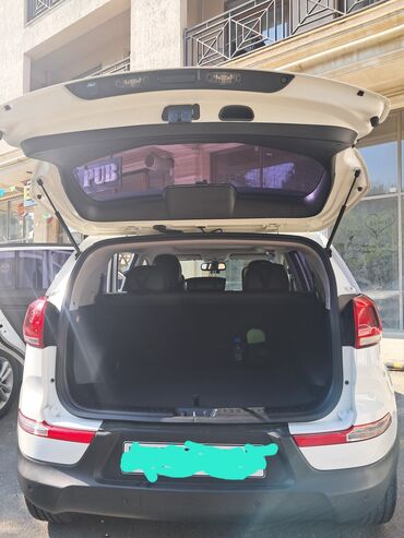 xacmaz masin: Kia Sportage – ağ rəngdə, şəhər və ailə üçün rahat krossover. - Ban