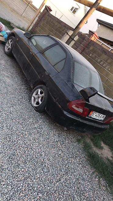 разбор матиз: Автомобиль – седан черного цвета (похоже на Daewoo/ЗАЗ Lanos по порогу — 7