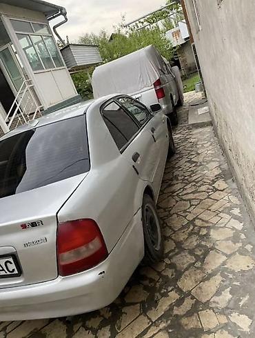 аренда mazda 323: Mazda 323: 2003 г., 1.4 л, Механика, Бензин, Седан — 4