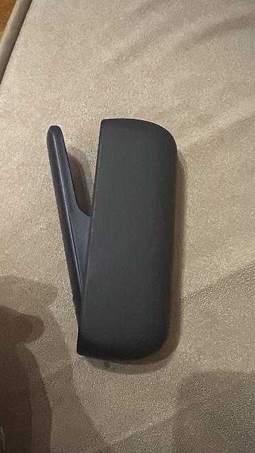 meduza qelyan: IQOS elektron tütün cihazı və qutusu. Tünd rəngli, kompakt və — 5