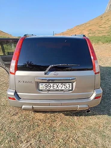 nissan note bufer: Nissan X-Trail (T30) – gümüşü rəngli, benzinlə çalışan kompakt SUV — 9