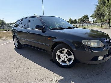 Транспорт: Mazda 323: 2002 г., 1.6 л, Механика, Бензин, Хэтчбэк — 2