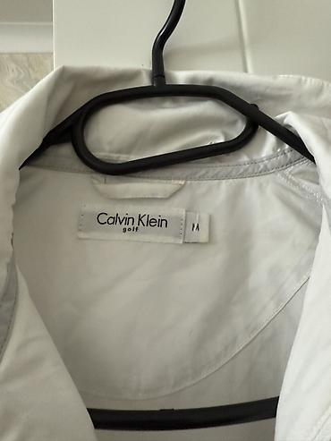 Kurtkalar: Calvin Klein Golf ağ yüngül küləkkeş (kurtka) haricden getirilib, çox — 2