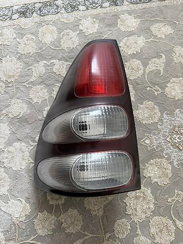 тико фар: Задний стоп-сигнал (левый). Оригинал на Toyota Prado 120. Матовый — 2