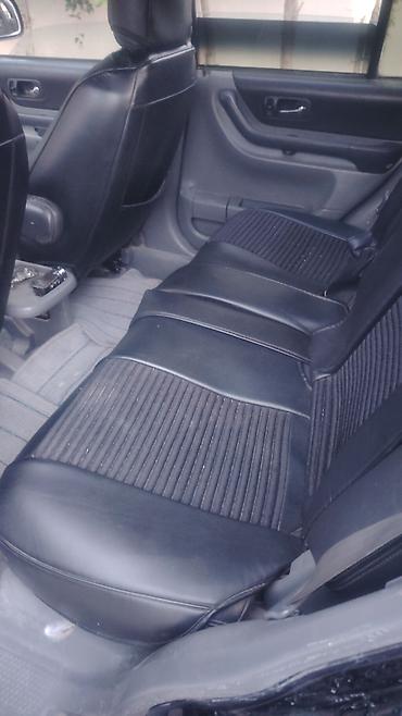islenmis hyundai avtomobilleri satisi: Honda CR‑V, qara rəng, 1-ci nəsil kuzov (təxmini 1997–2001). - Kuzov — 6