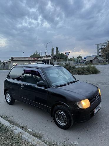 муравей с бензином: Daihatsu Cuore: 2001 г., 1 л, Механика, Бензин, Купе — 2