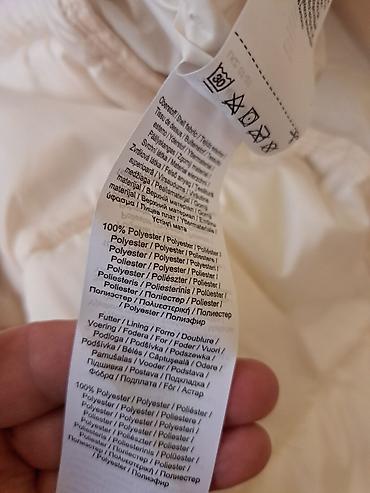 Zimske jakne: Ženska duga perjana/pufer jakna u svetlo bež boji. - Dužina do — 12