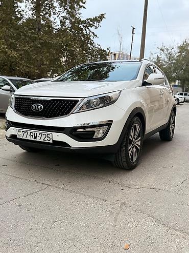 su radiatoru: Kia Sportage, ağ rəng, kompakt krossover. Güclü və qənaətcil — 1
