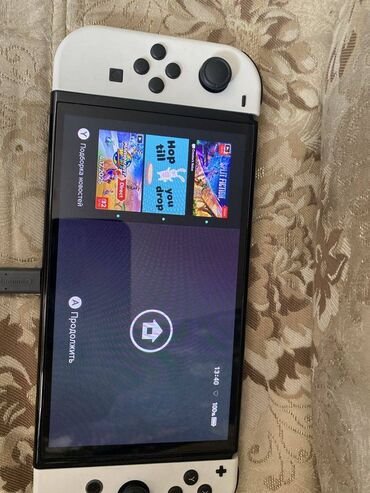 en ucuz oyun konsolları: Nintendo switch oled. Ideal veziyyetde. Oyunlari var icinde. Qutusu ve