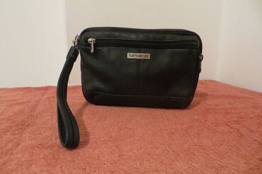 bolero crni: SAMSONITE,muska kvalitetna torbica za na ruku, jako prakticna, bez