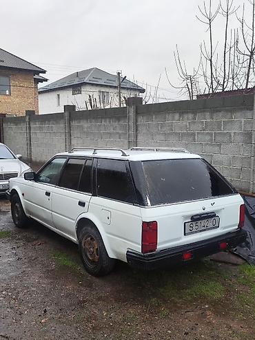 byd e1: Nissan Bluebird: 1988 г., 2 л, Механика, Универсал — 1