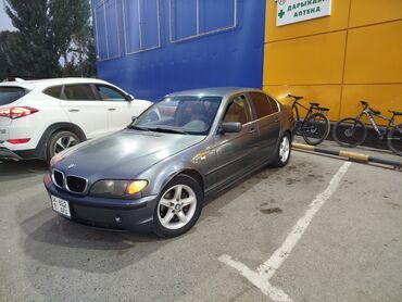 блок управления мерс 3 2: Седан BMW 3 серии темно-серого цвета с четырьмя дверями. Автомобиль