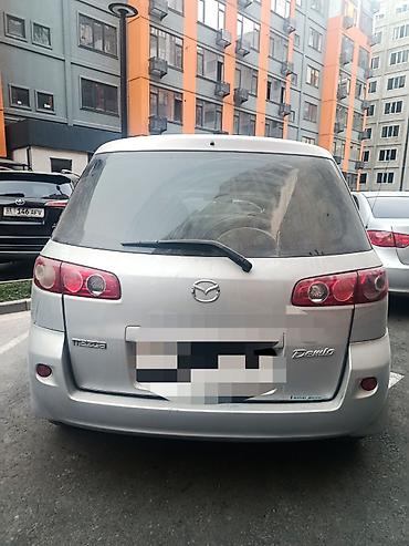света музука: Mazda Demio: 2006 г., 1.3 л, Автомат, Бензин, Хэтчбэк — 1