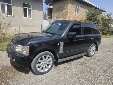 диски на ниву б у: Черный внедорожник Range Rover, оснащенный литыми дисками и боковыми