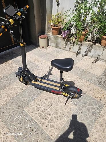 Электротранспорт: Elektrikli skuter – oturacaqlı model Xüsusiyyətlər: - Güclü ön ikili — 2