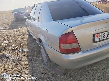 forester 2004: Mazda Familia: 2000 г., Бензин, Седан — 4