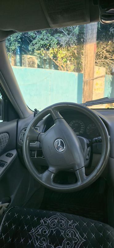 япония машина: Mazda Capella: 2000 г., 2 л, Механика, Бензин, Универсал — 7