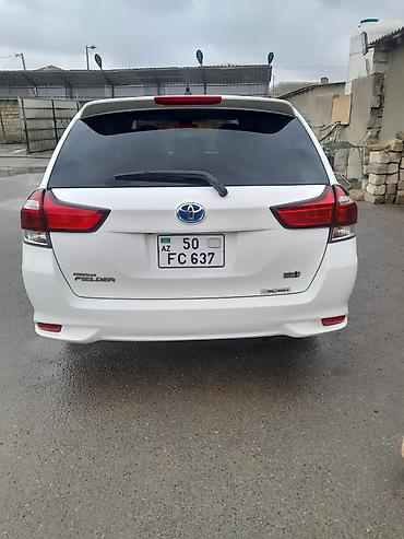 fielder: Toyota Corolla Fielder Hybrid – universal kuzovlu, ağ rəng. - Hibrid — 2