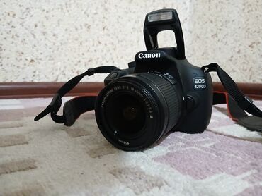 Фотоаппараты: Зеркальная камера Canon EOS 1200D с комплектным объективом Canon EF‑S
