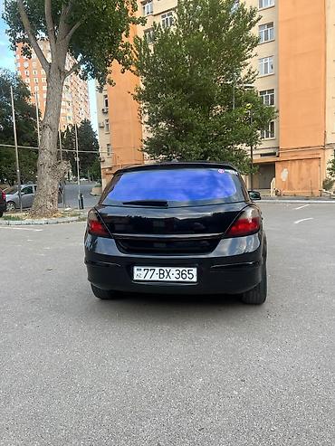 mini cooper 2009: Marka/model: Opel Astra H (hatchback, 5 qapı) Rəng: qara (parlaq) — 5