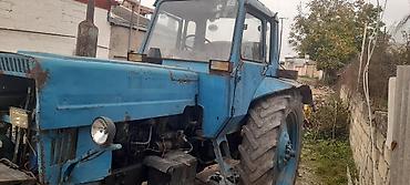 kreditlə masinlar: Mavi rəngli MTZ tipli təkərli traktor Xüsusiyyətlər: - Dizel — 2