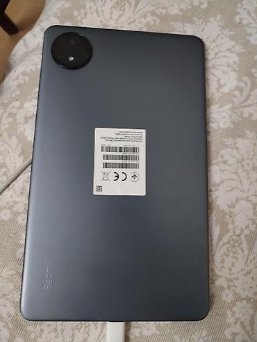 tab s10: Redmi planşet - Model: Redmi (arxa qapaqda loqo və informasiya — 3