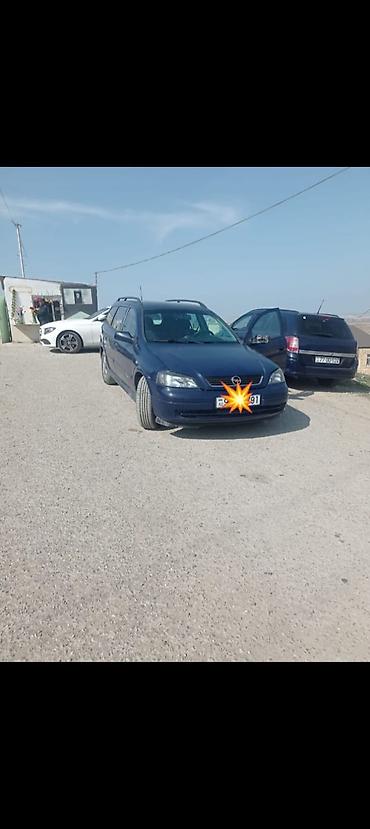opel astra kompressor: Opel Astra Caravan (universal kuzov), tünd mavi rəng. Xüsusiyyətlər — 2