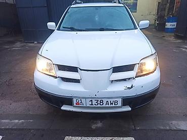 где принимают аккумуляторы: Mitsubishi Outlander: 2003 г., 2.4 л, Автомат, Газ, Кроссовер — 4