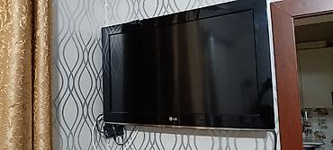 televizor asilqani: LG LCD televizor – divar asılqanı ilə - Ekran: təxminən 32" LCD — 1