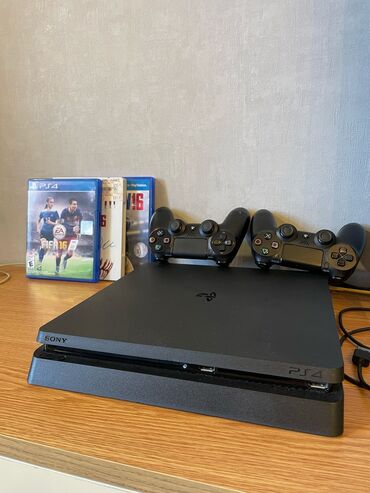 купить playstation 3: Sony PlayStation 4 Slim 1TB . Sekilde gorunen komplekte daxildi
