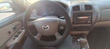 двери рекс: Mazda Familia: 2001 г., 1.5 л, Автомат, Бензин, Седан