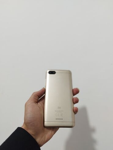 telefon flai fs517: Xiaomi Redmi 6A, 32 ГБ, цвет - Оранжевый, 
 Кнопочный