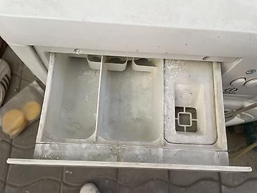 круглый: Стиральная машина Indesit с фронтальной загрузкой. Белый корпус — 4