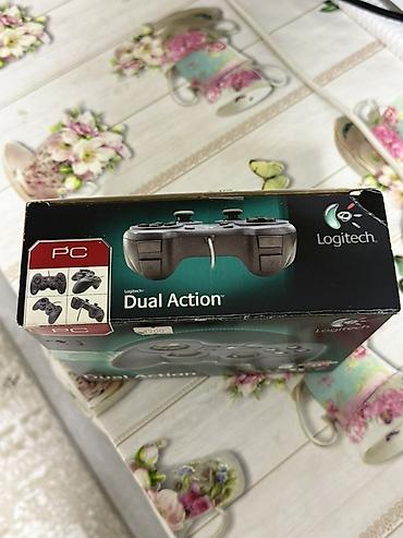 nintendo controller: Logitech Dual Action — проводной геймпад для ПК и Mac. Особенности: - — 4