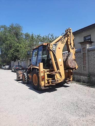 Экскаватор, Caterpillar, Колесный