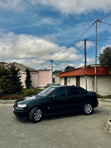 bmw e 38: Opel Astra: 1.6 l | 1999 il 400 km Sedan — 8