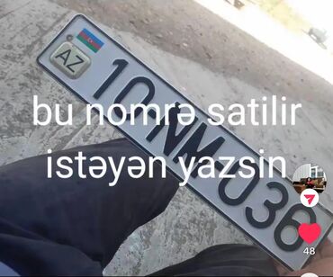 Qoşqular: Avtomobil üçün "10 NM 036" seriyalı dövlət qeydiyyat nişanı. Nişan ağ