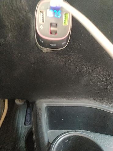 canon eos 250d: Avtomobil üçün FM transmitter və USB şarj cihazı. Cihaz avtomobilin — 1