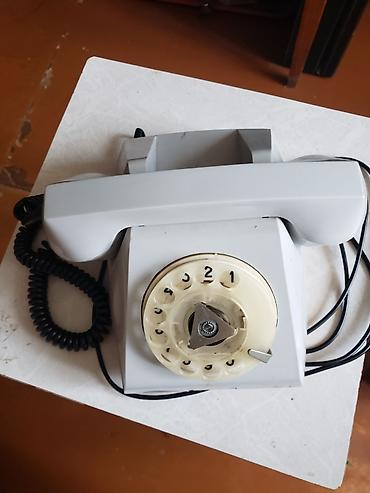 Stasionar telefon Simli, İşlənmiş, Ünvandan götürmə