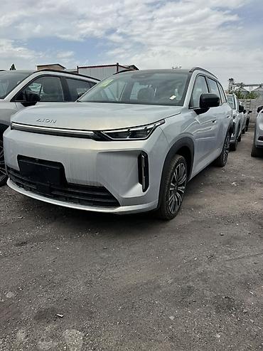 byd e1: Электромобиль Aion (кроссовер) Кузов и дизайн: - Современный — 1